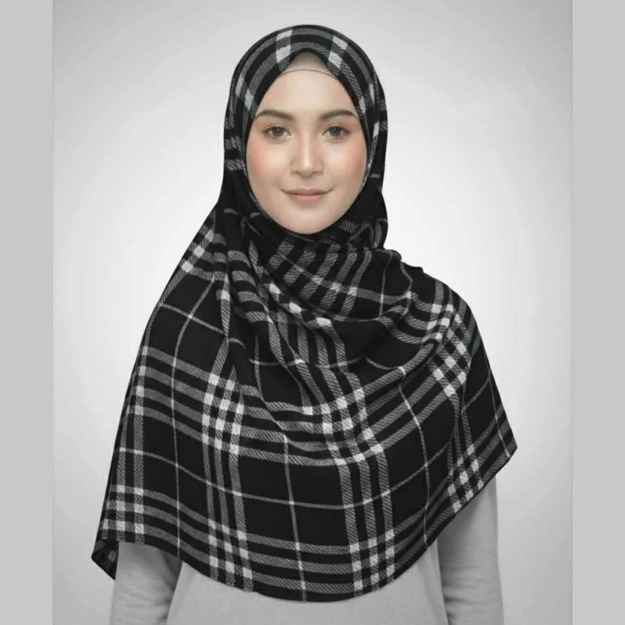 Woman wearing a black and white checkered crepe printed hijab with plaid lines