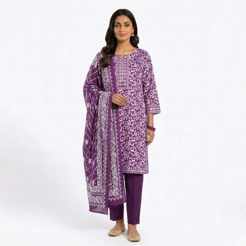 Model wearing purple printed cotton three piece dress with matching printed dupatta