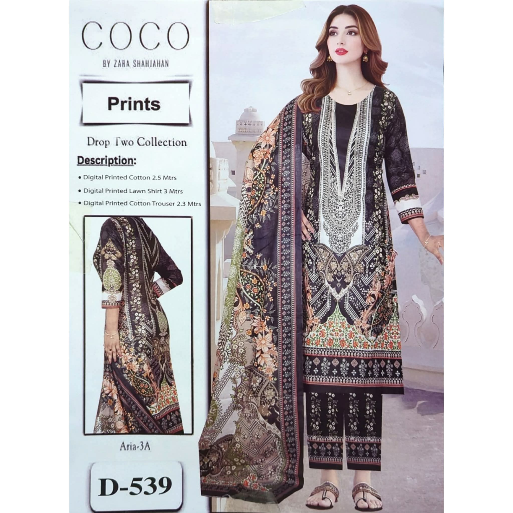 A beautiful Pakistani lawn cotton three piece suit for women. Black color, with digital print in peach, cream and green. It includes a long shirt, a dupatta and trousers. Front and back view. Model image. Design D-539.
