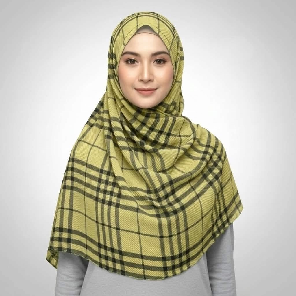 Woman wearing an olive green checkered crepe printed hijab with black grid lines