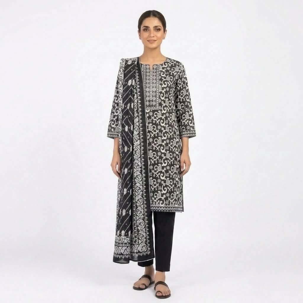 Model wearing black and white printed cotton three piece dress with matching dupatta